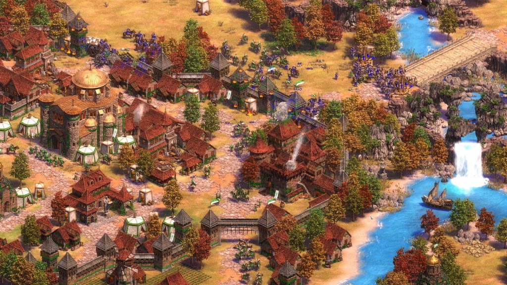Age of Empires II: Definitive Edition town with villagers gathering resources