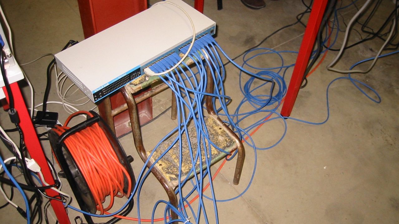 Rows of PC players at a LAN party in France in 2003